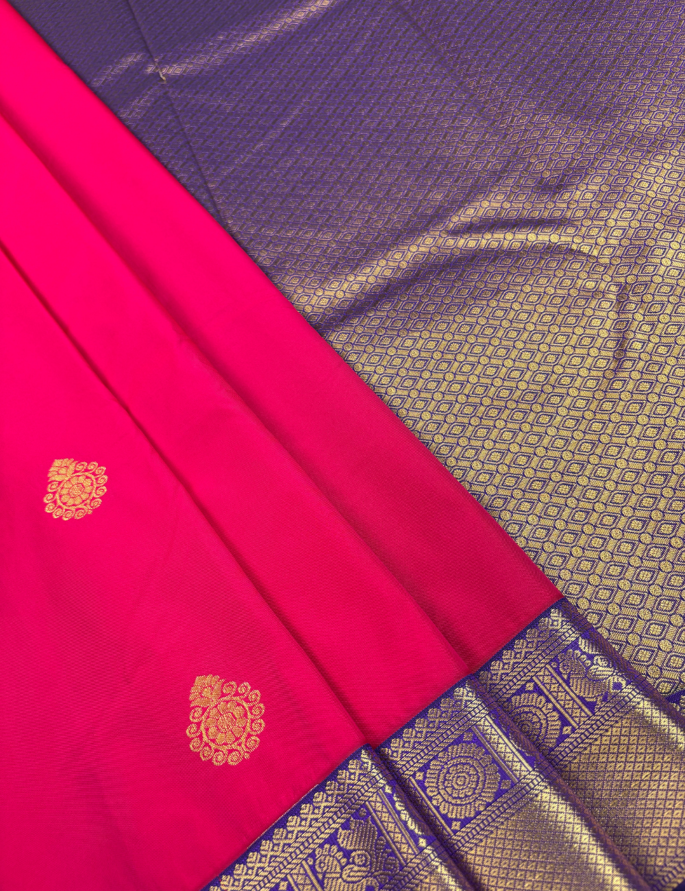 Coral Red Semi Silk Saree with Contrast Royal Purple Zari Border & Gold Chakram Motifs