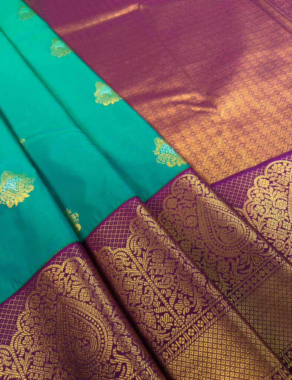 Peacock green soft semi silk kanjivaram saree with magenta korvai border