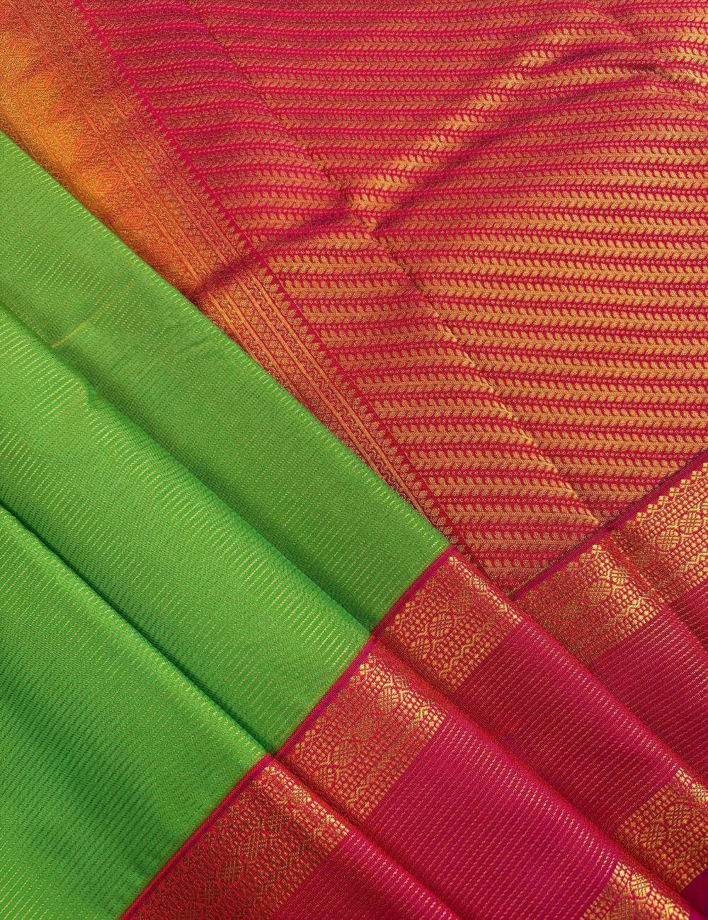 Parrot Green Soft Semi Silk Kanjivaram with Rani Pink Retta Pettu Zari Border