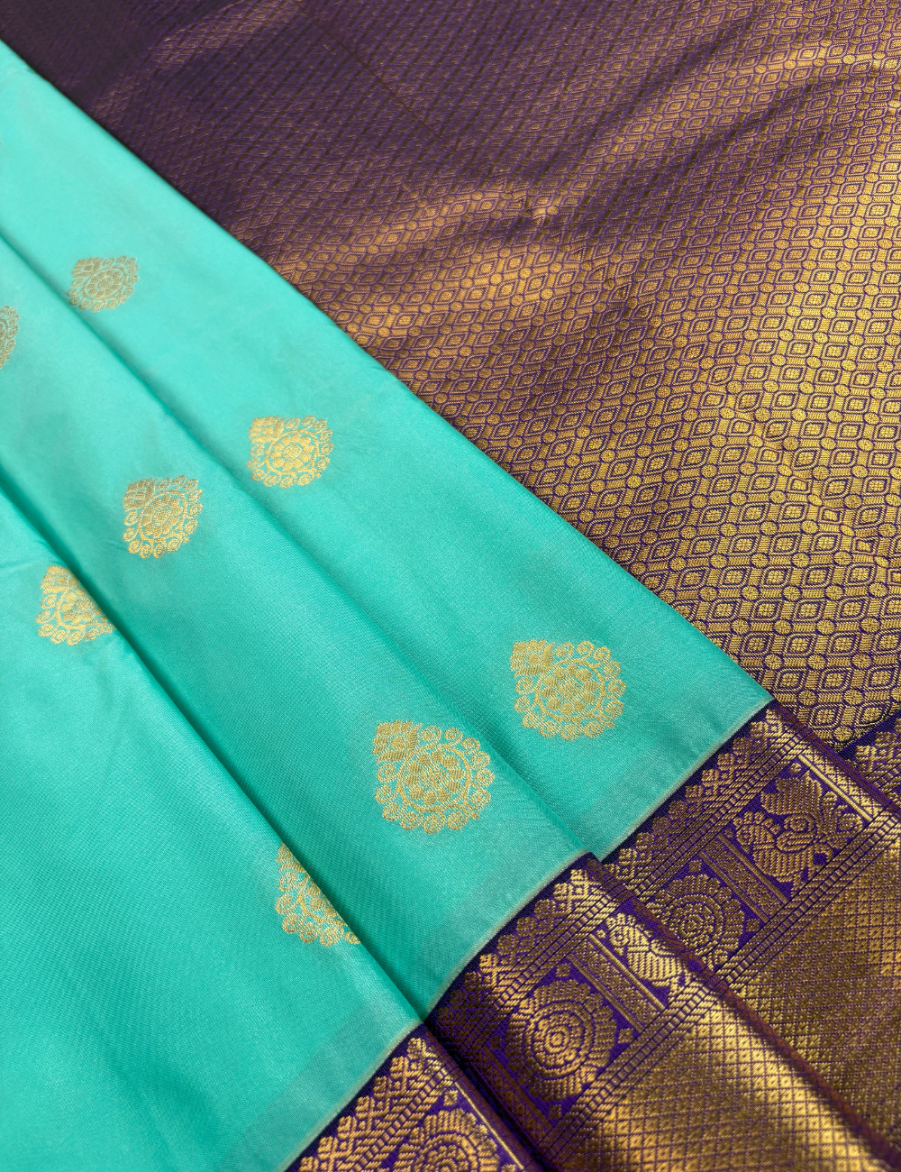 Sea Green Semi Silk Saree with Contrast Royal Purple Zari Border & Gold Chakram Motifs