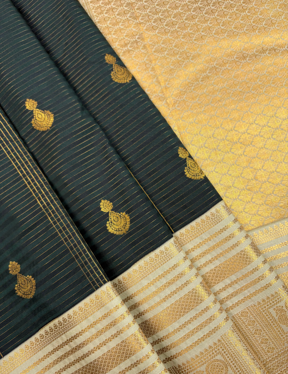 Deep bottle green soft semi silk kanjivaram saree with off white korvai border