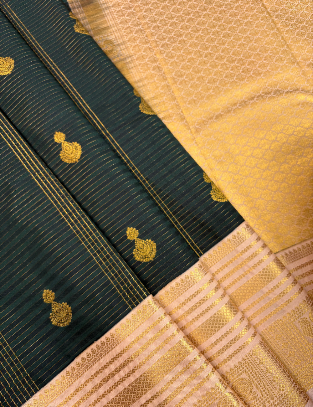 Bottle green soft semi silk kanjivaram saree with korvai peach border