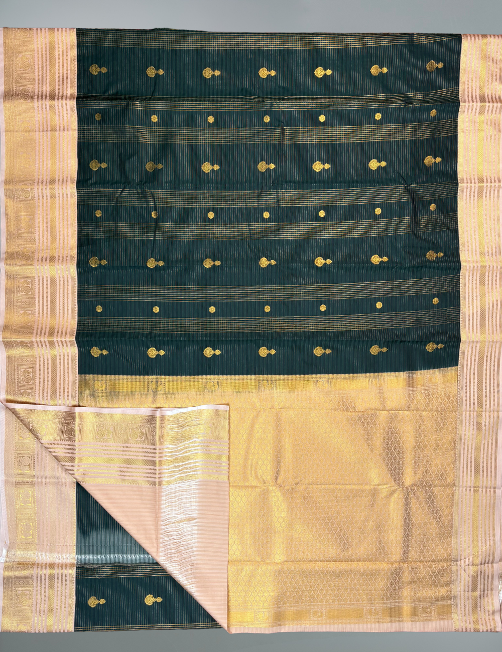 Bottle green soft semi silk kanjivaram saree with korvai peach border