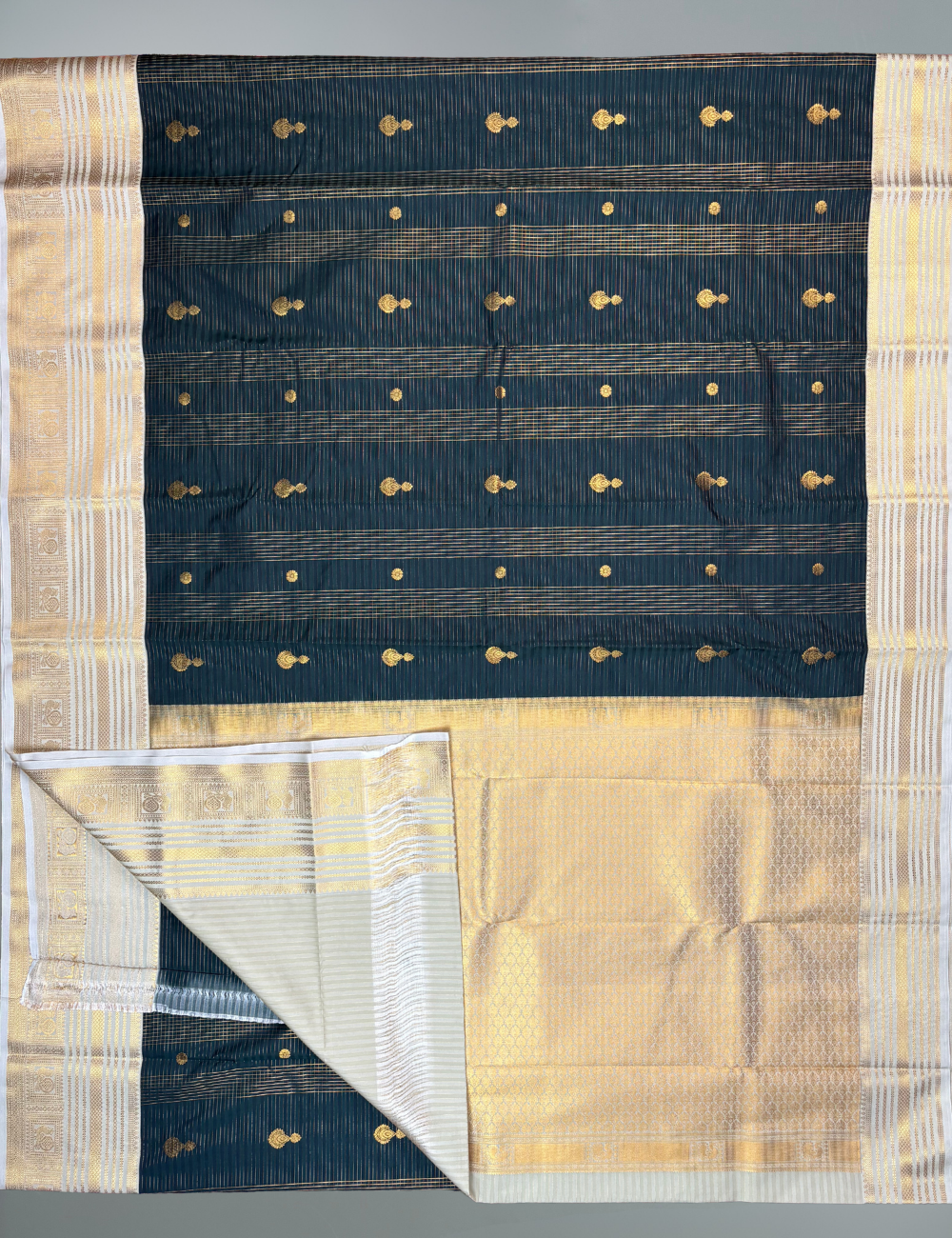 Deep bottle green soft semi silk kanjivaram saree with off white korvai border