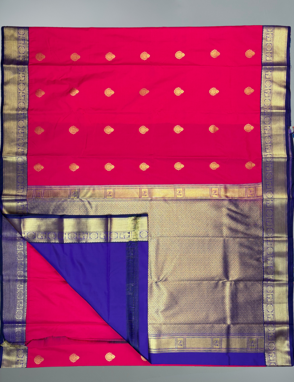 Coral Red Semi Silk Saree with Contrast Royal Purple Zari Border & Gold Chakram Motifs