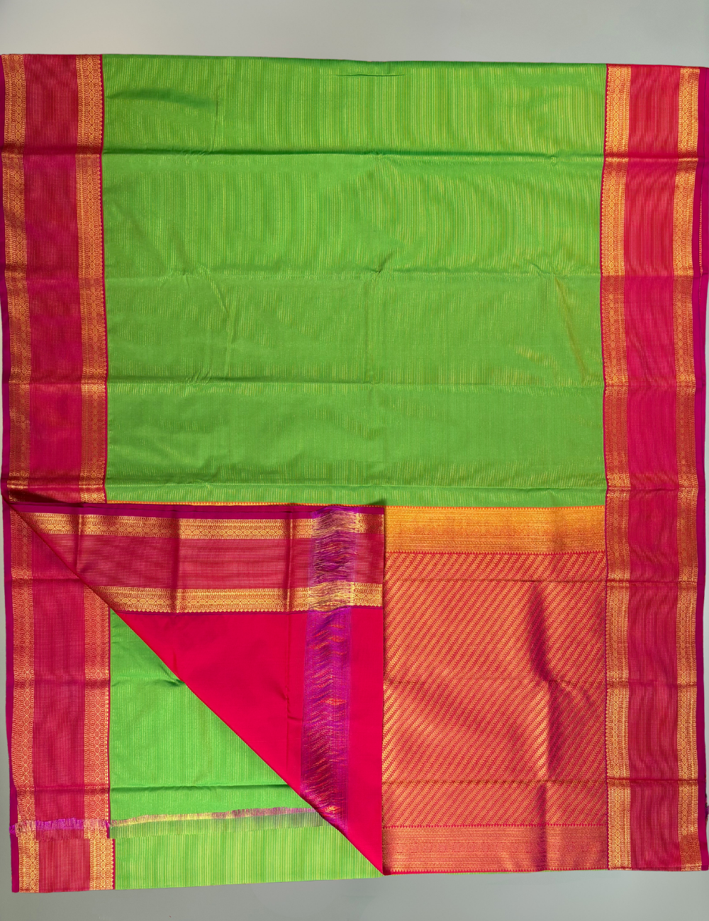 Parrot Green Soft Semi Silk Kanjivaram with Rani Pink Retta Pettu Zari Border