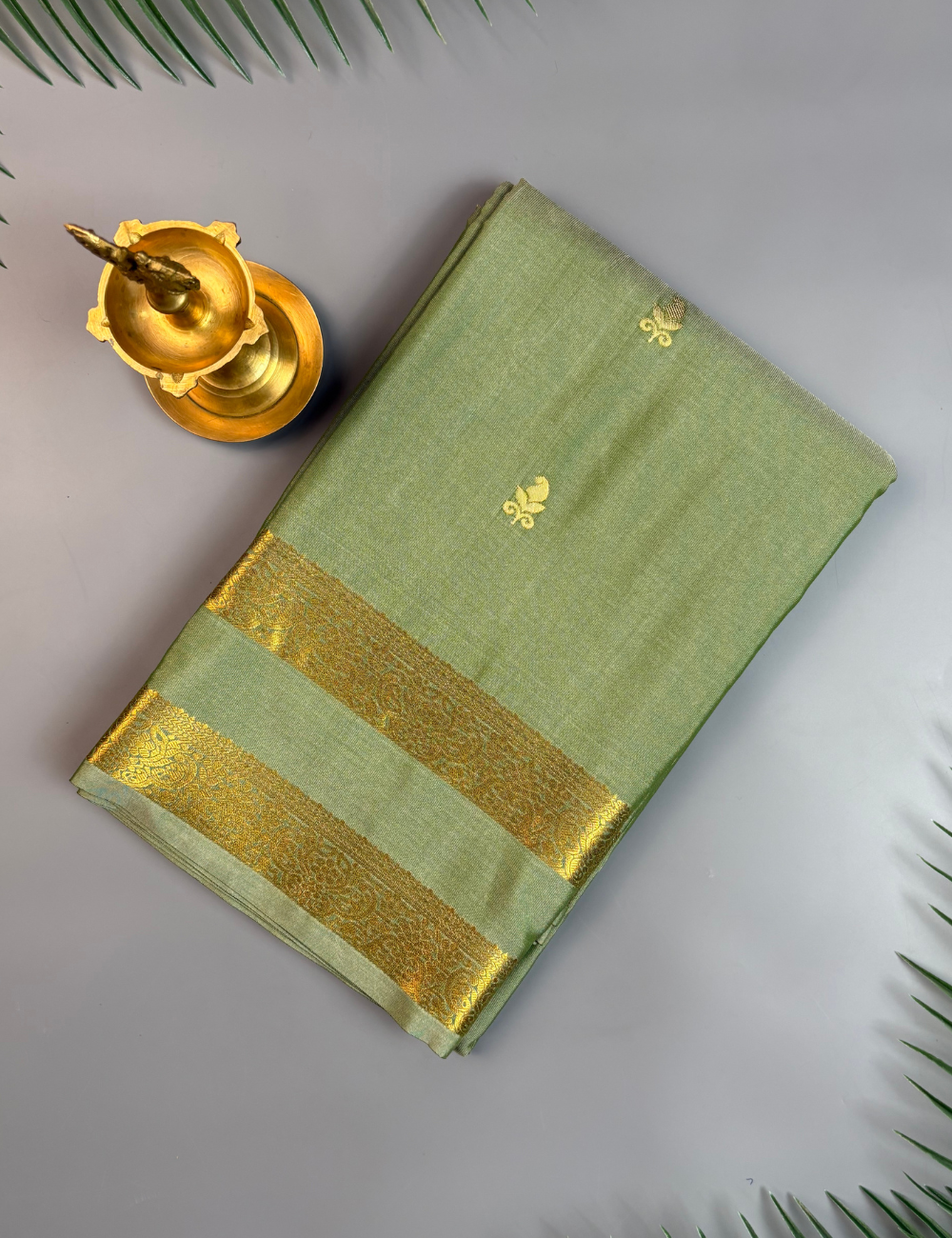 Sage Green Soft Semi Silk Saree with Gold Zari Border & Floral Buttis