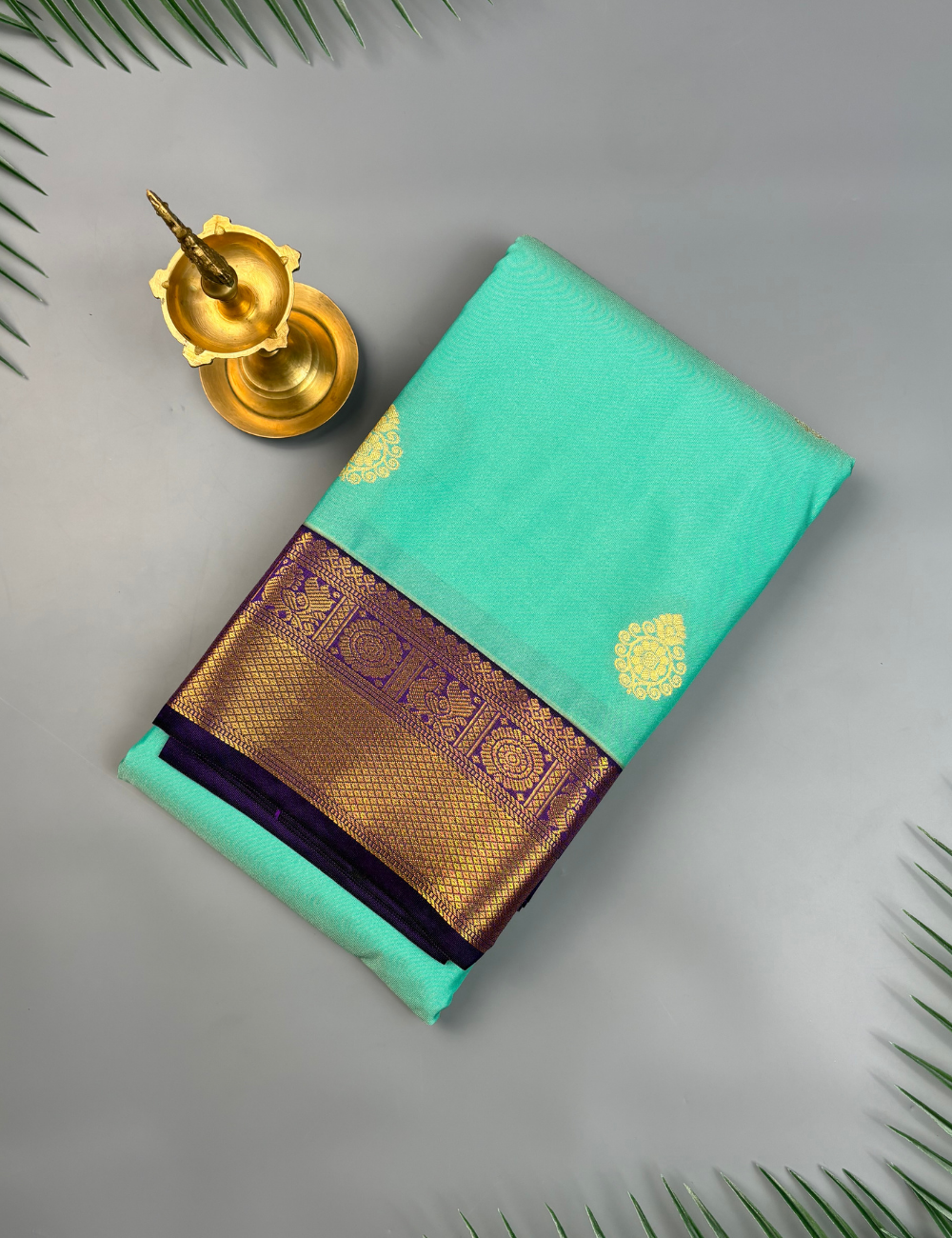 Sea Green Semi Silk Saree with Contrast Royal Purple Zari Border & Gold Chakram Motifs