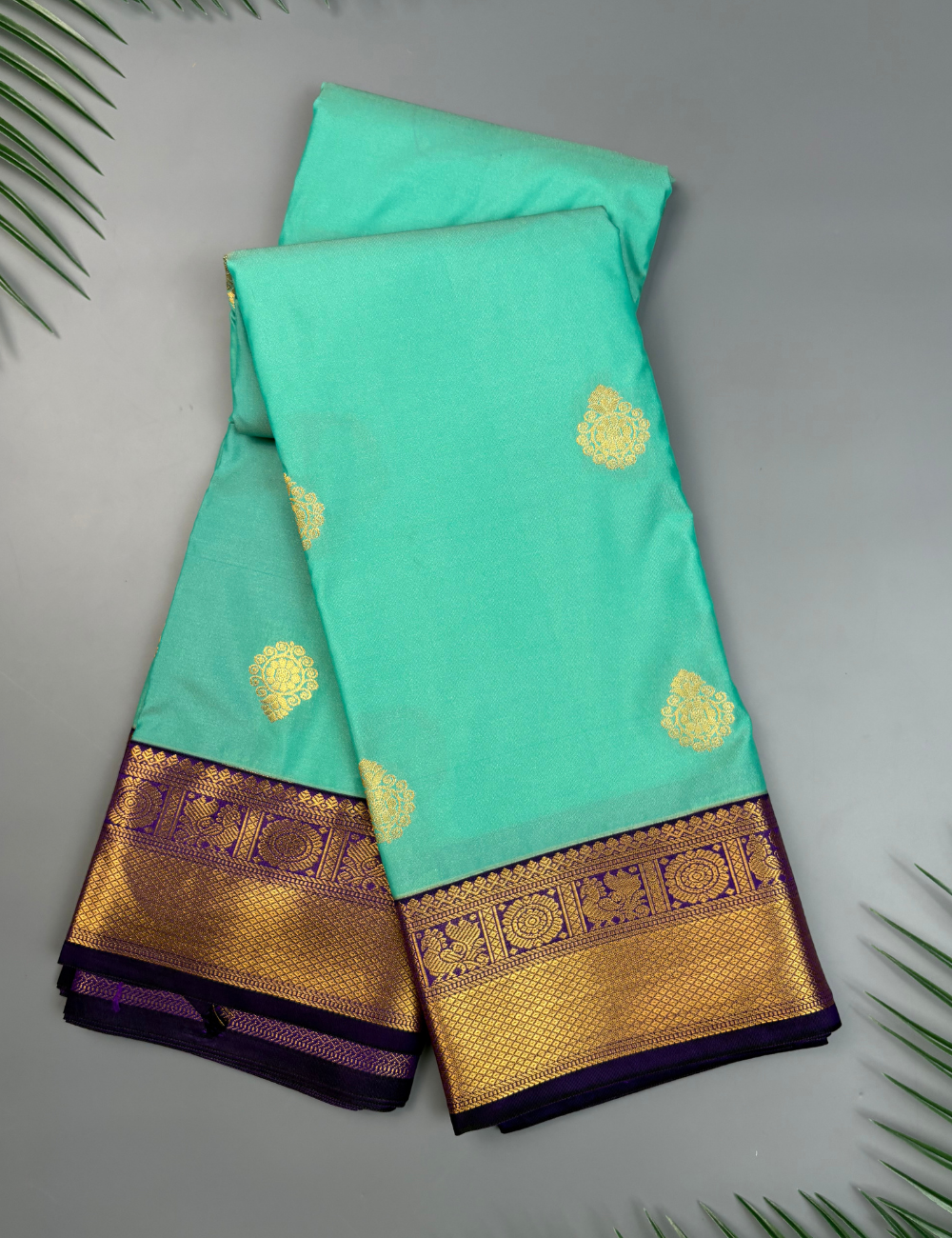 Sea Green Semi Silk Saree with Contrast Royal Purple Zari Border & Gold Chakram Motifs