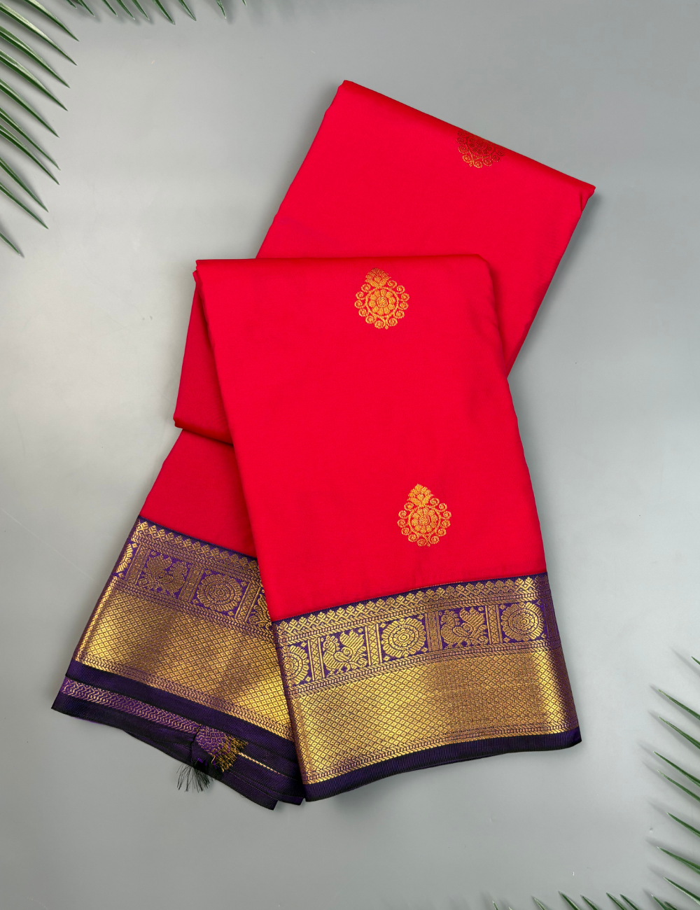 Coral Red Semi Silk Saree with Contrast Royal Purple Zari Border & Gold Chakram Motifs